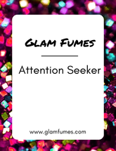 A product image featuring the brand name 'Glam Fumes' and the perfume and body oil name 'Attention Seeker' in bold letters, set against a vibrant, colorful background.